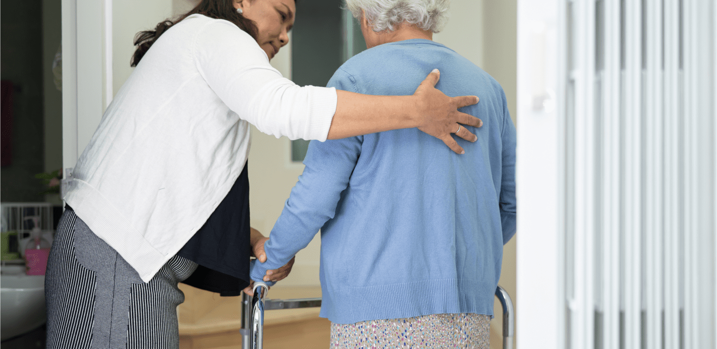 Caregiver offering support in a home setting
