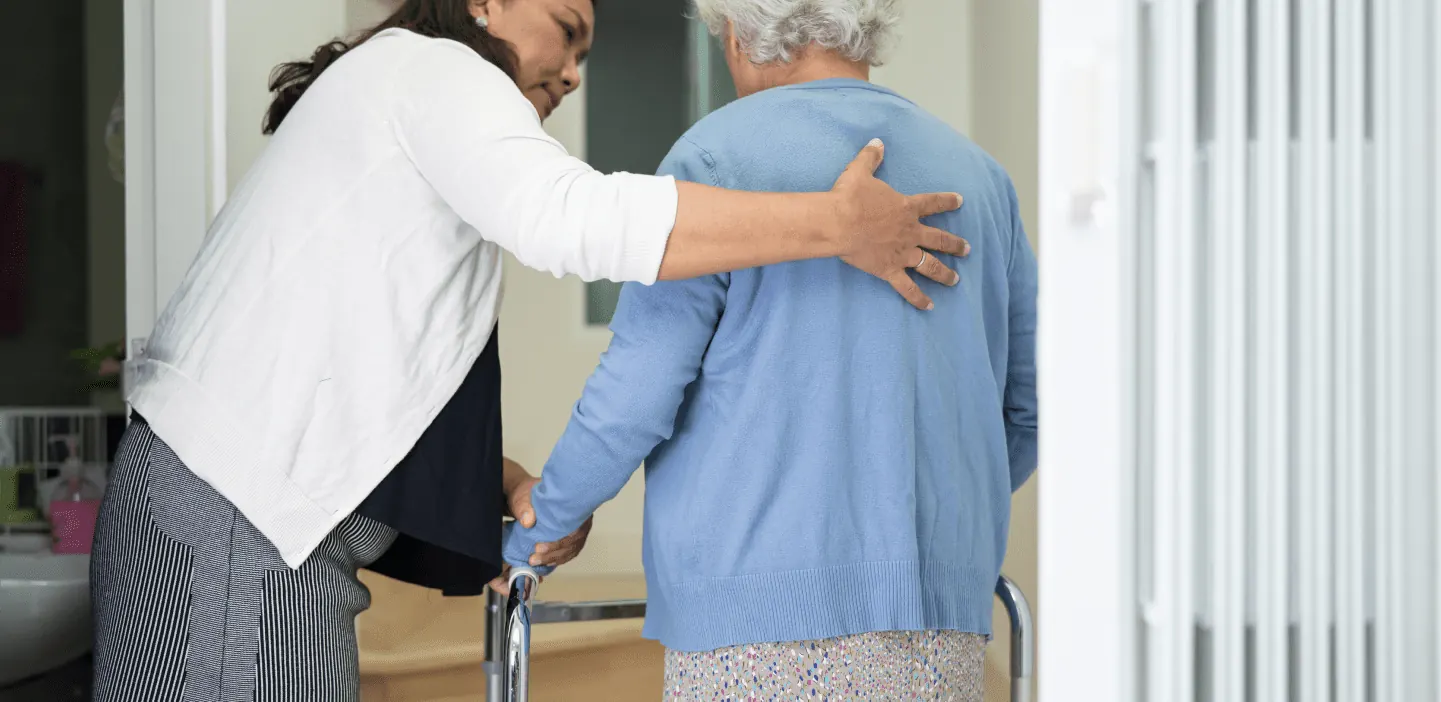 Caregiver offering support in a home setting